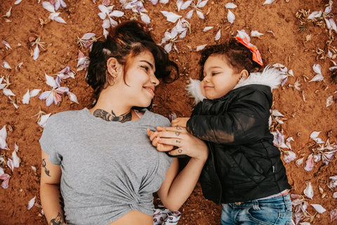 Mother with her daughter, settled and at ease — the steady presence The Grounded Parent trains you to bring back.